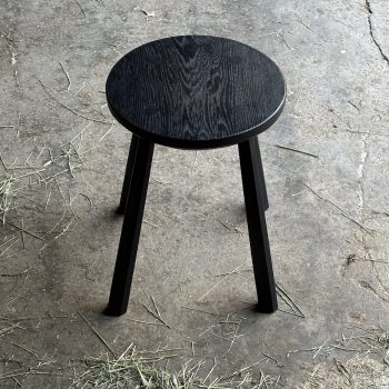 Oak round stool - Black by John Crossley